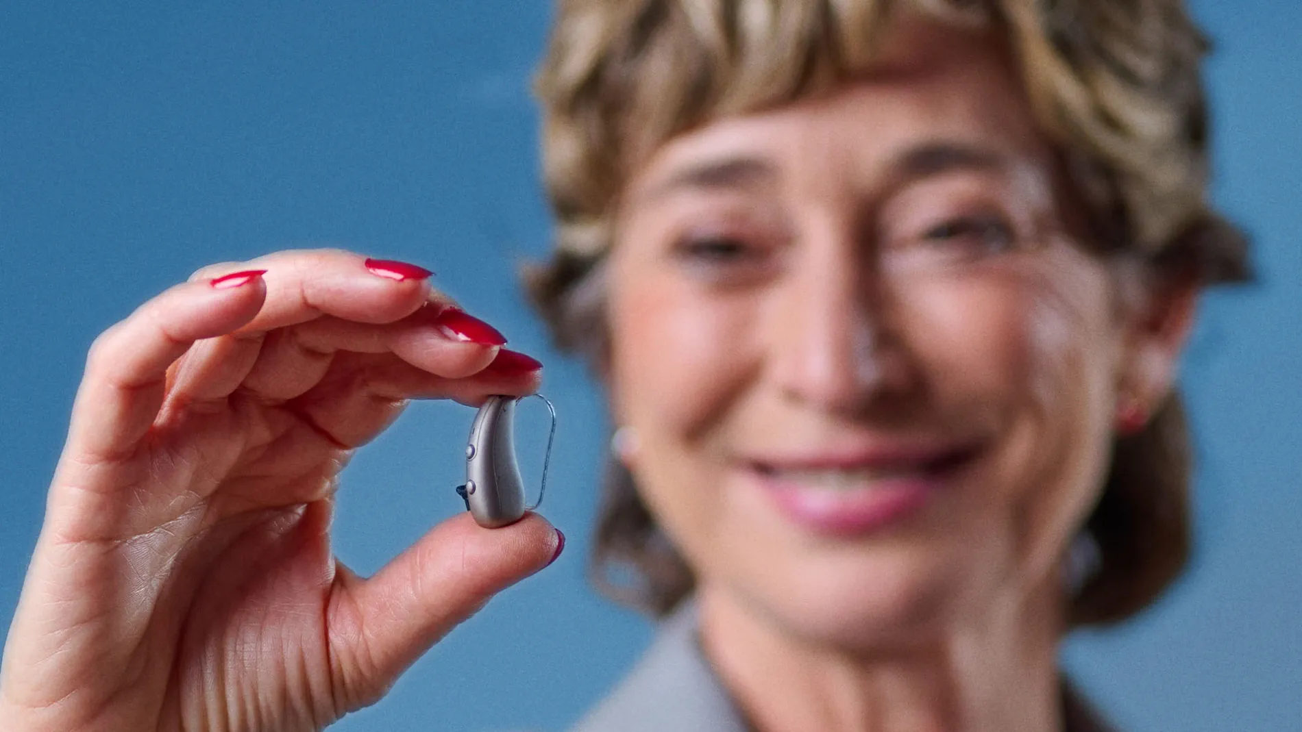 audiologist holding pure charge and go